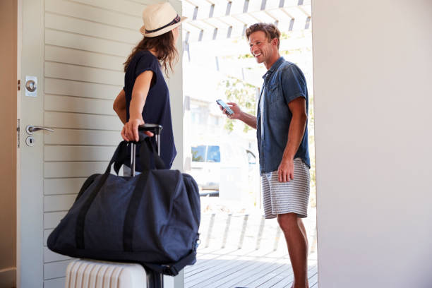 istock Couple Using Online App To Book Cab For Vacation 929545992