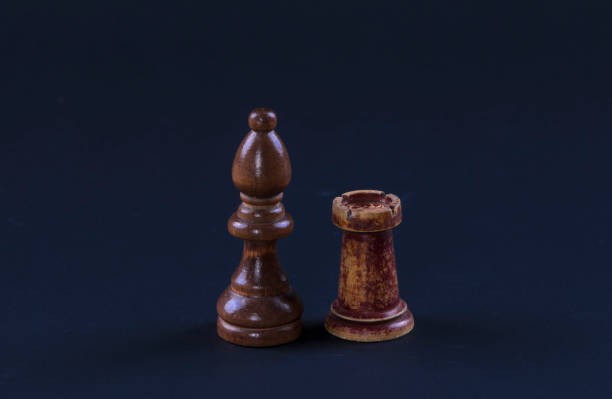 istock chess officer and rook on a black background 929548250