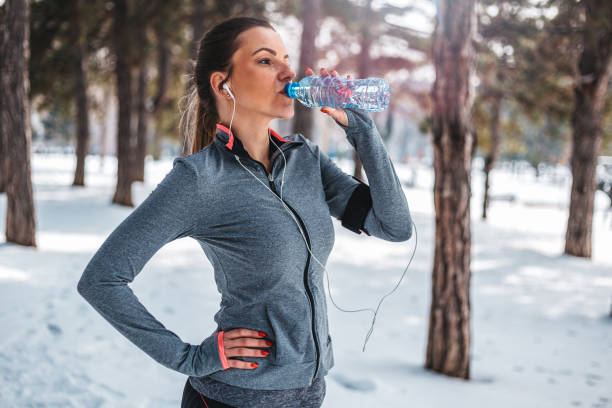 istock Fitness woman drinking water 929549252