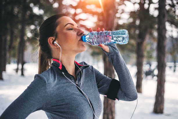 istock Fitness woman drinking water 929549256