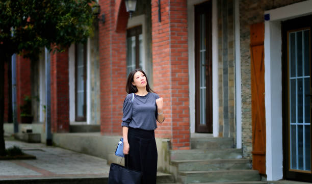 istock Pretty woman walking down the street 929555512