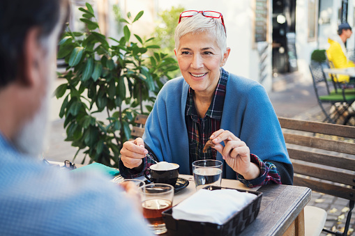 Mature woman at restaurant on lunch