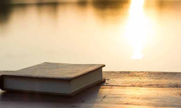 istock Notebook on the wooden Table with bokeh Sunset 929568868
