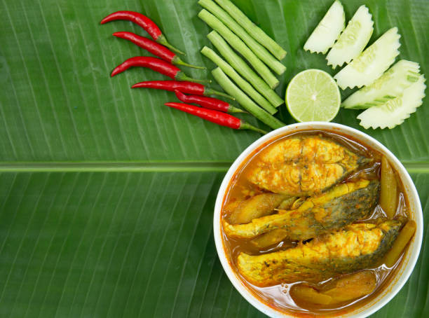 istock Yellow curry snapper fish , thai food and vegetable / selective focus and top view image 929569130
