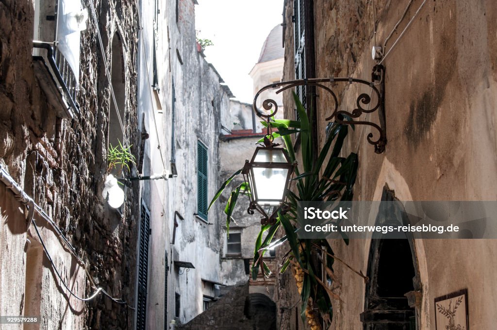 Street lantern in Cervo in Liguria in Italy Street lantern in the old town of Cervo at the coast of Liguria in Italy Alley Stock Photo