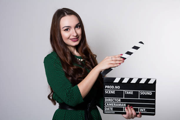 istock Young woman holding a movie clapper 929581914