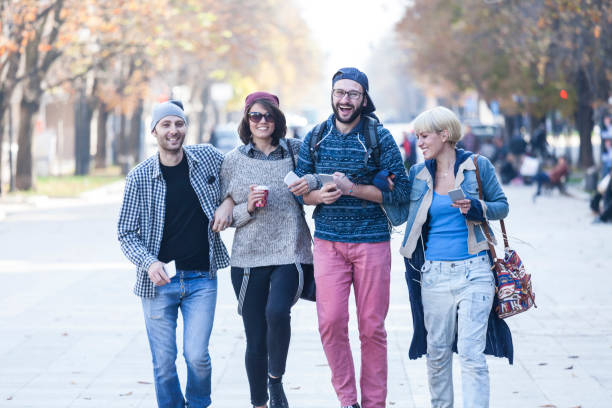 istock Friends walking on street and having fun 929584198
