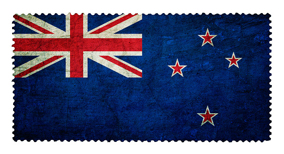 Flag of New Zealand on grunge postage stamp background isolated
