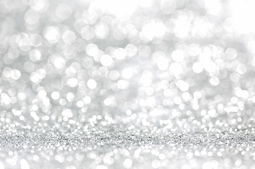 Abstract silver and white glitter lights background