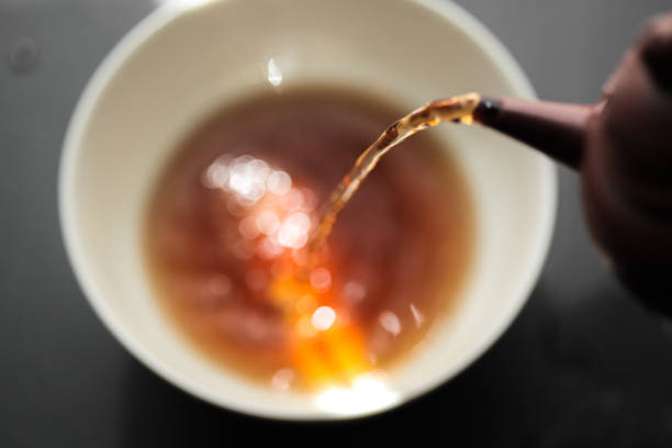 istock Pu Erh Tea being poured into bowl 929592410