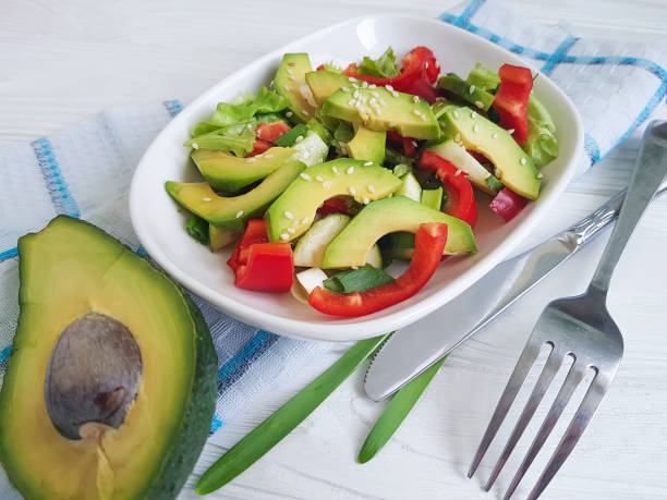 istock salad with avocado and sesame seeds on a wooden 929595314