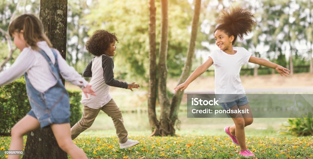 little girl playing with friend little girl playing outdoor - child kids and friend happy. Child Stock Photo