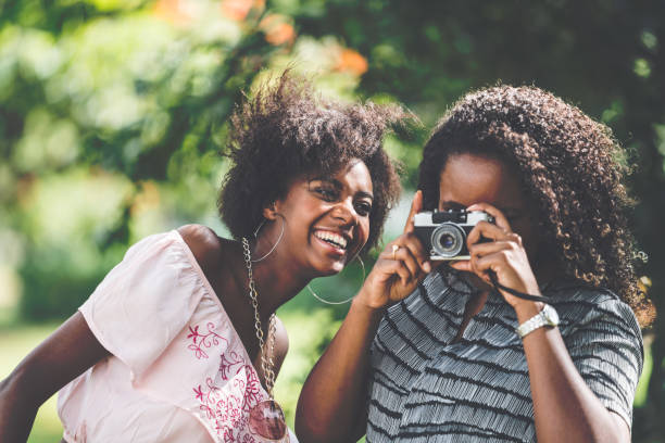 istock Friends Having Fun with Analogue/Retro Camera 929605126