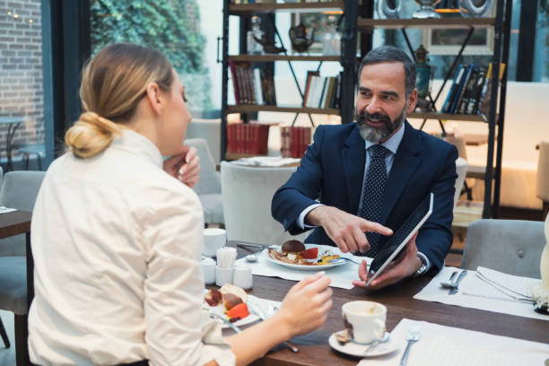 istock Business people have a meal in hotel restaurant 929606204
