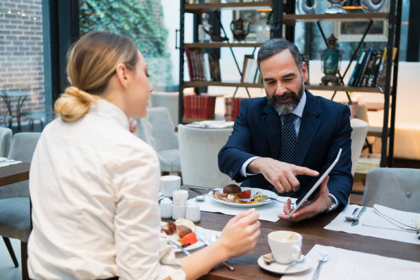 istock Business people have a meal in hotel restaurant 929606238