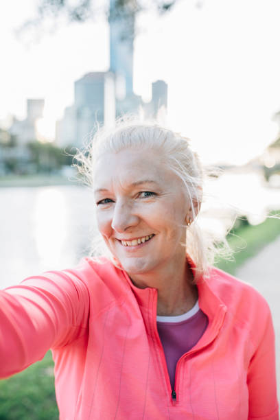 istock Happy senior female runner takes a selfie 929606648