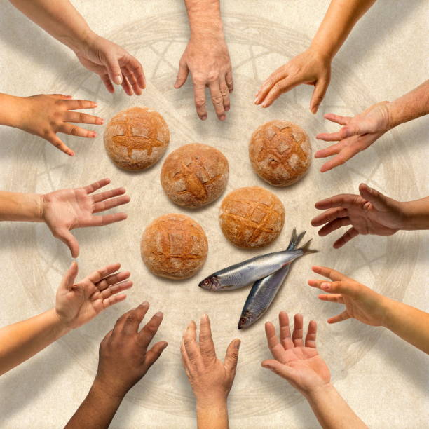 istock Five small barley loaves and two small fish for many 929628254