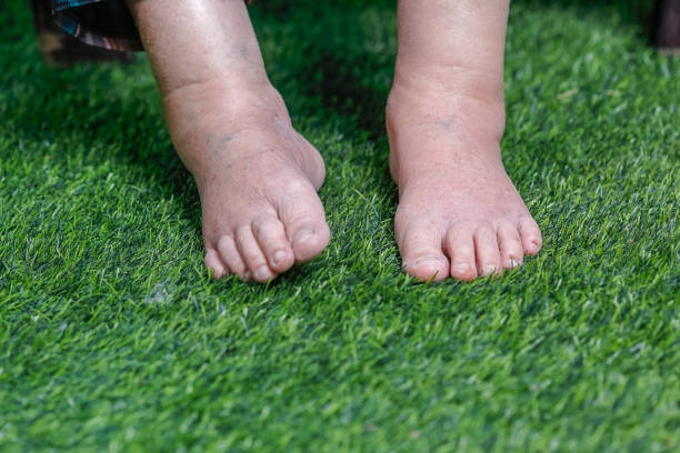 Child feet on the grass. Selective focus. Kid.