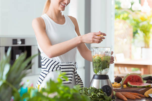 istock Happy vegan woman mixing vegetables 929632888