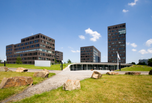 The International Criminal Court : flag and building in background. The Hague, Netherlands.