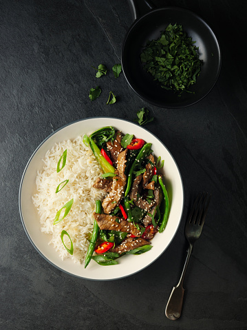 Home made freshness Oriental beef stir fry with bok choy,broccoli,and red chilli  with basmati rice