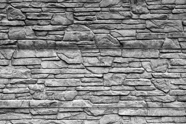 istock Black and white stone brick wall detailed contrast texture background 929642260