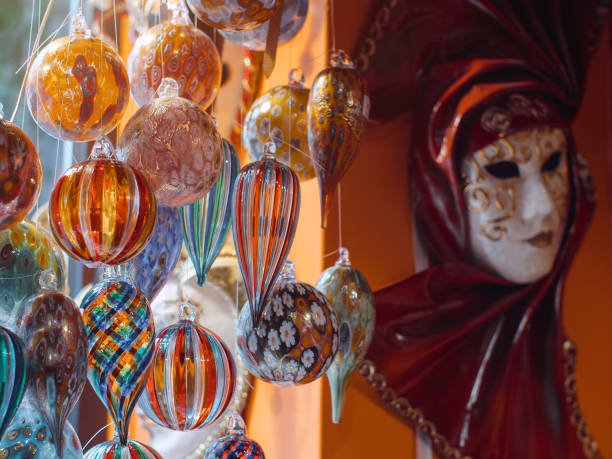 Colorful souvenirs from the famous murano glass Colorful souvenirs from the famous murano glass. Venetian masks in store display in Venice. Annual carnival in Venice is among the most famous in Europe. Its symbol is the Venetian mask murano stock pictures, royalty-free photos & images