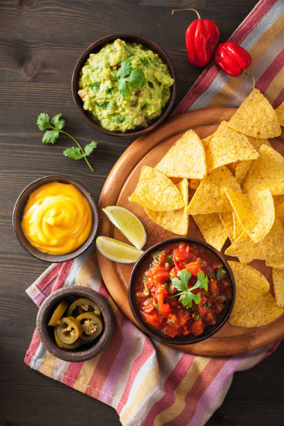 istock mexican nachos tortilla chips with guacamole, salsa and cheese dip 929661830