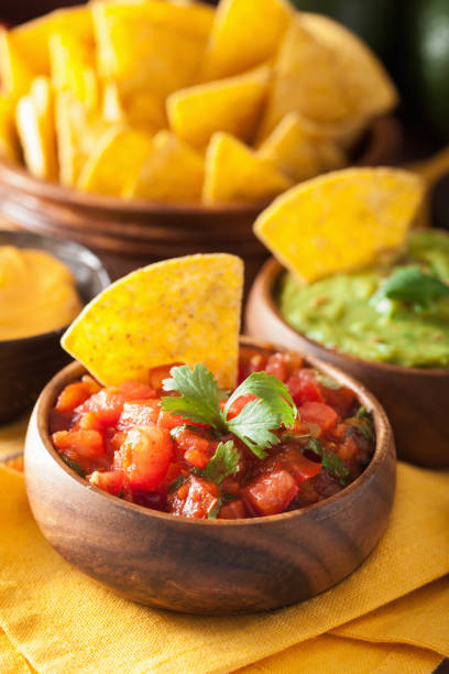 istock mexican nachos tortilla chips with guacamole, salsa and cheese dip 929662130