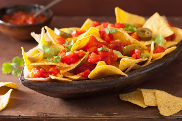 istock nachos loaded with salsa, cheese and jalapeno 929666342
