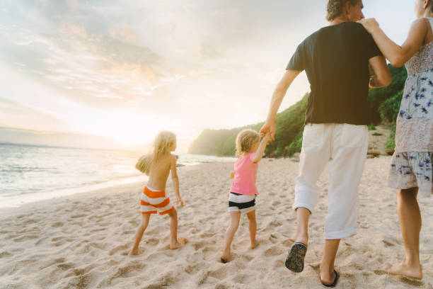 istock Family  walking on the beach in Bali 929671628