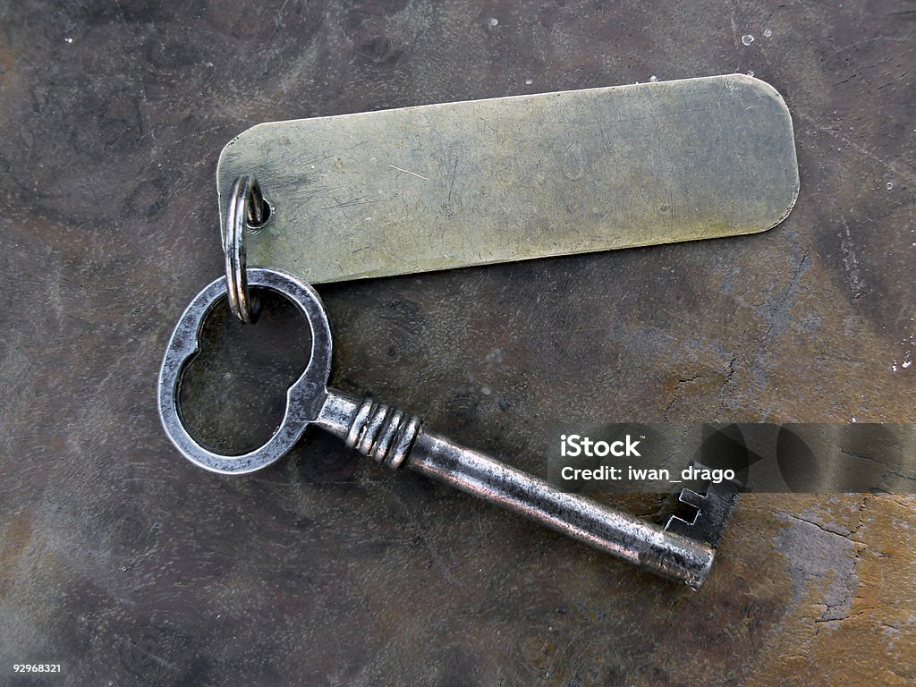 Винтажный ключ с keytag - Стоковые фото Ключ роялти-фри