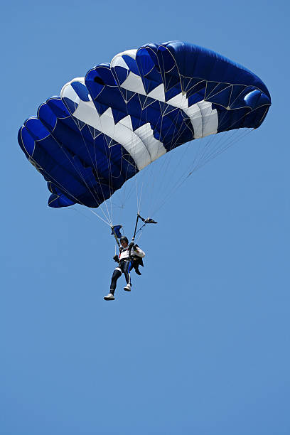 Parachutist in air Parachutist in action glider hang glider hanging sky stock pictures, royalty-free photos & images