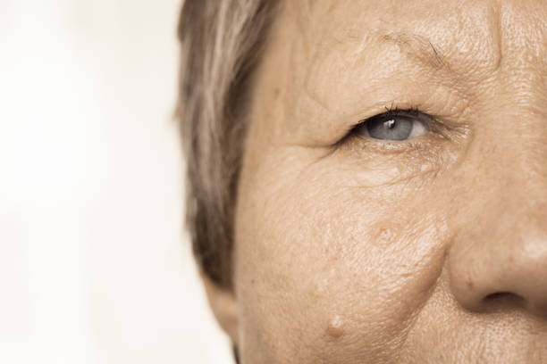 istock Elderly pensioner female half face portrait closeup 929692394