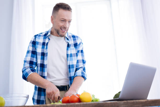 istock Attractive pleased man watching receipt 929694452