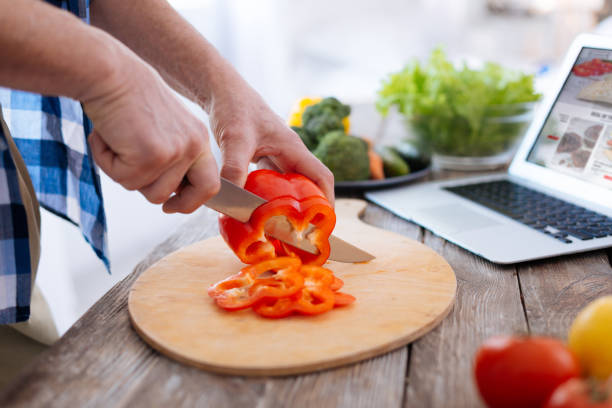 istock Male young hands felling bell pepper 929697136