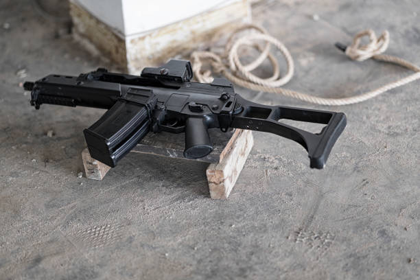 istock The machine gun is put on the floor. Blur background is the entangled rope. 929704834