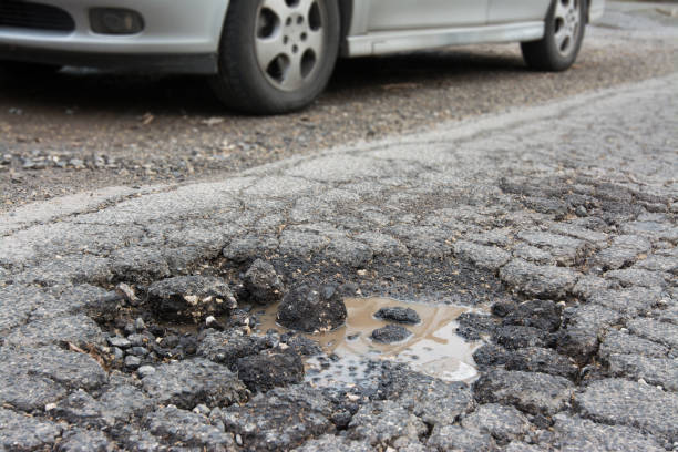 istock Big pothole caused by freezing and rain in Rome, Italy 929715924