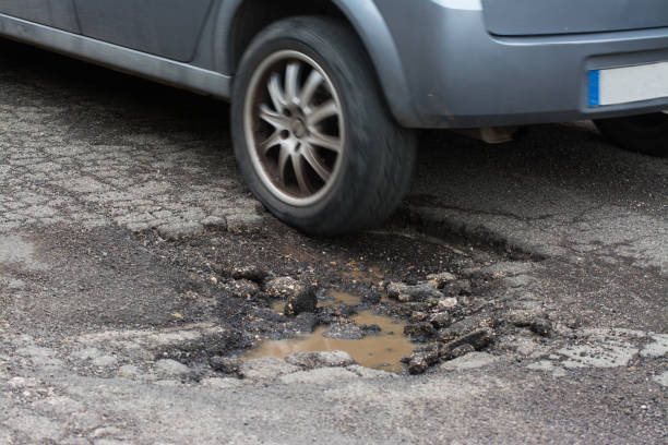 istock Big pothole caused by freezing and rain in Rome, Italy 929716114