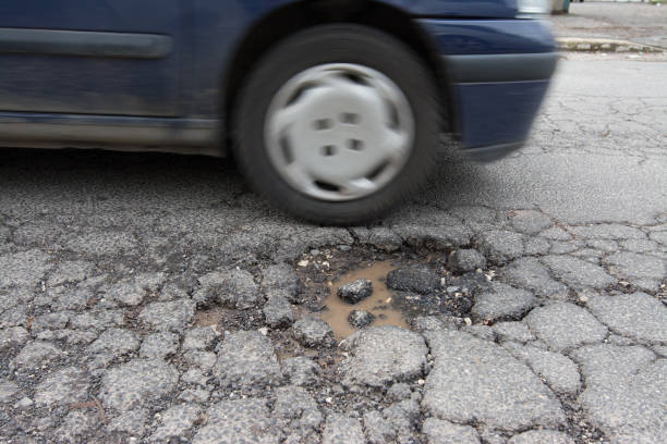 istock Big pothole caused by freezing and rain in Rome, Italy 929716230