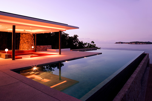 Luxury Island Villa Home In The Tropics Along The Coastline At Sunrise