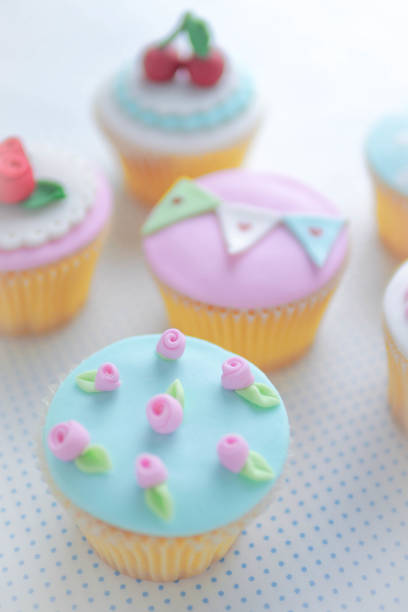 istock Rose and strawberry fondant cupcakes. 929720272