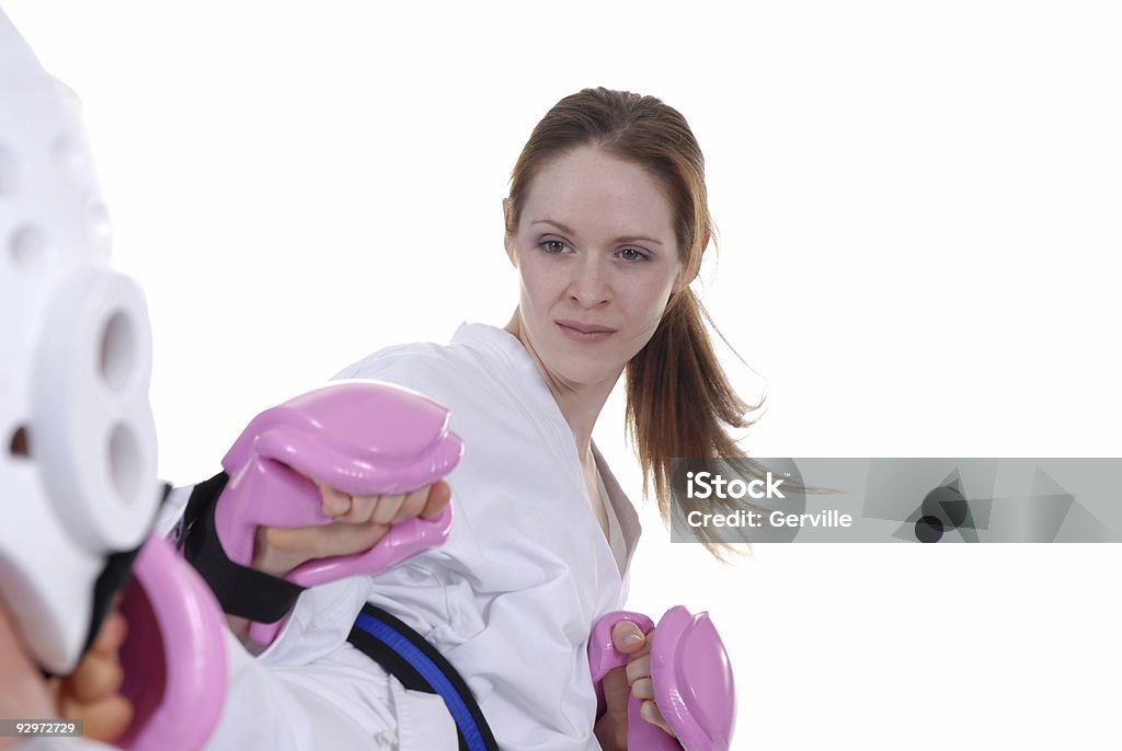 Taekwondo knockouts Martial artist hitting her target. Adult Stock Photo