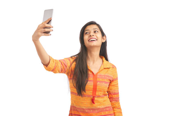 istock Attractive young women making selfies on phone camera 929730908