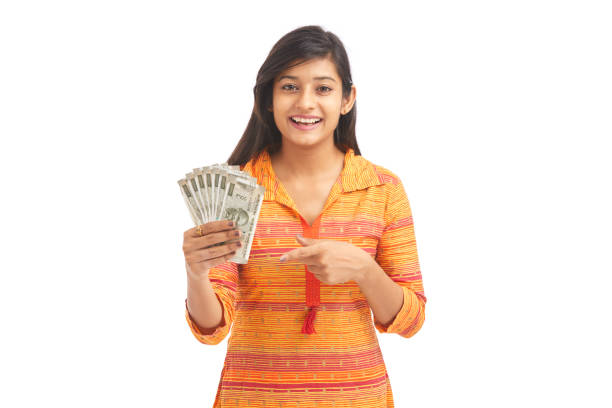 istock Young happy woman holding 500 rupee notes 929731174