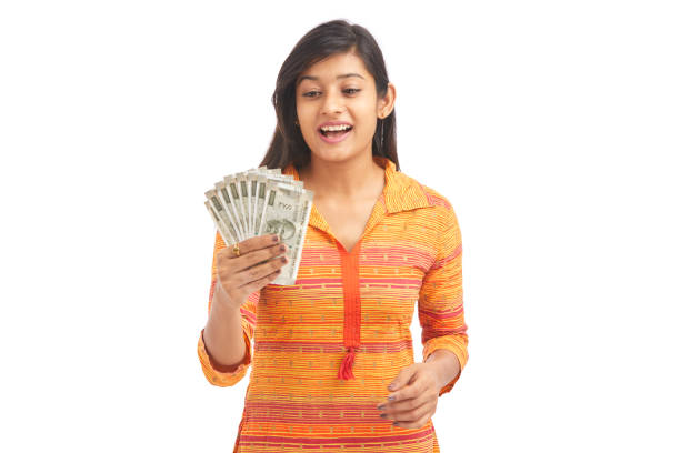 istock Young happy woman holding 500 rupee notes 929731180
