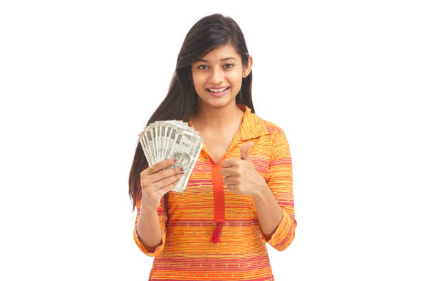 istock Young happy woman holding 500 rupee notes 929731184