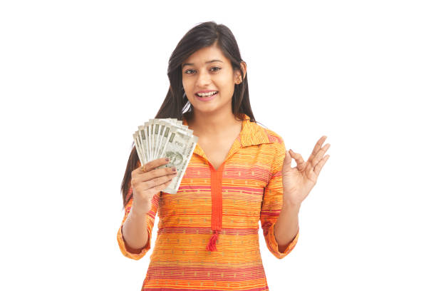 istock Young happy woman holding 500 rupee notes 929731186