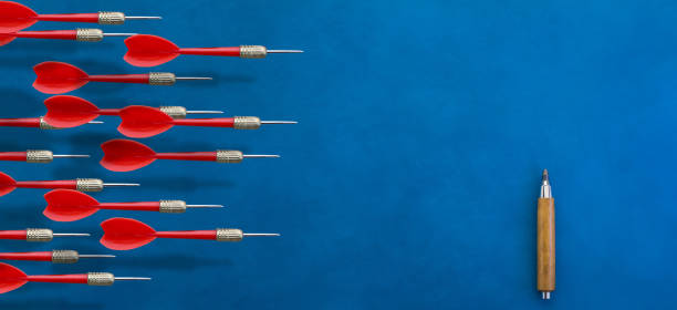 istock red darts arrow fly over blue leather background leader concept with free copysapce for your text 929731374