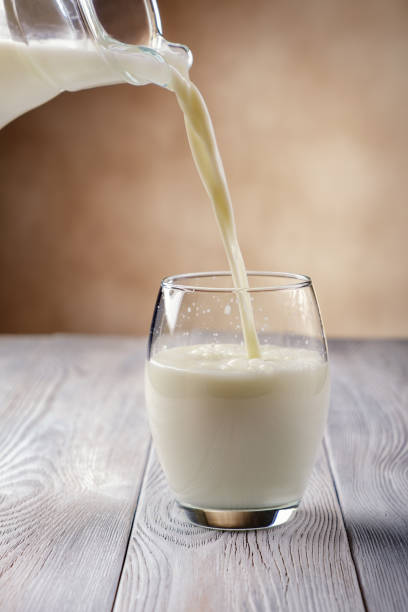 istock Pouring milk into glass 929731962